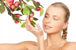 picture of lovely woman with apple twig