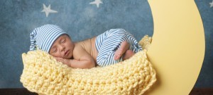 Newborn Boy Sleeping on the Moon