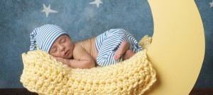 Newborn Boy Sleeping on the Moon