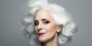 Grey haired woman with red lip stick, portrait.