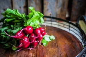 Radishes on wooden background