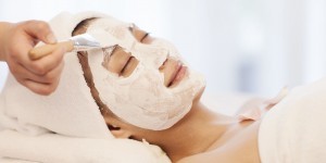 An Asian woman having facial spa treatment